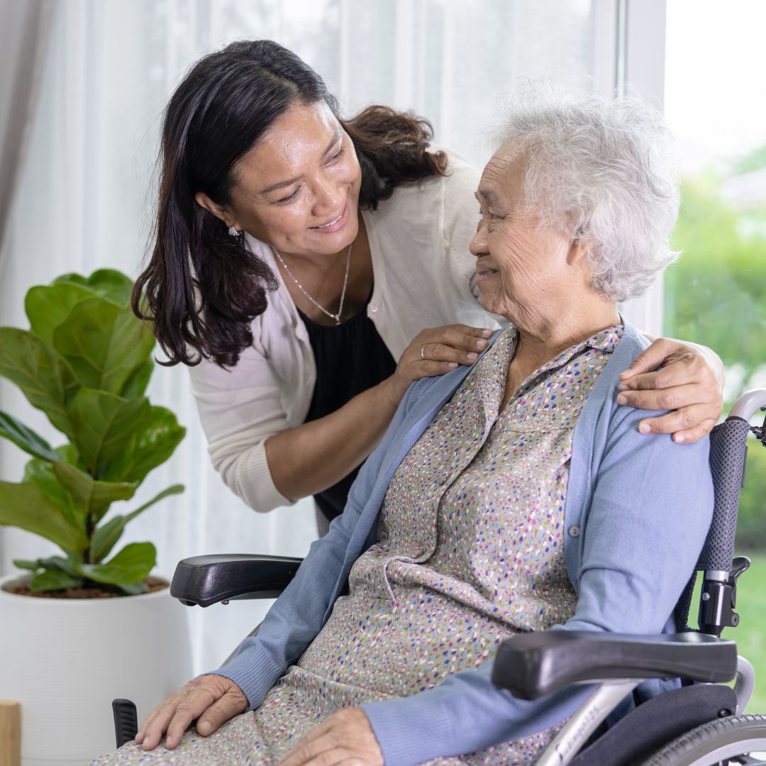 Patient in a wheelchair and her daughter. 